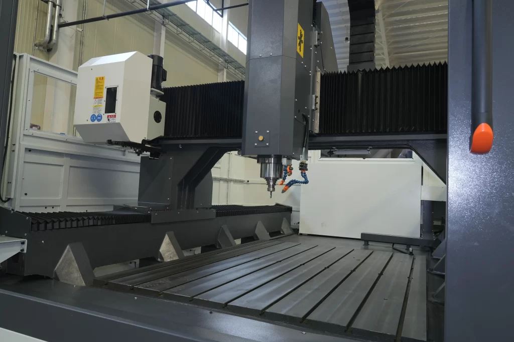 Close - up of 3 - axis CNC gantry machining center’s spindle and worktable, emphasizing precision for accurate 3 - axis operations