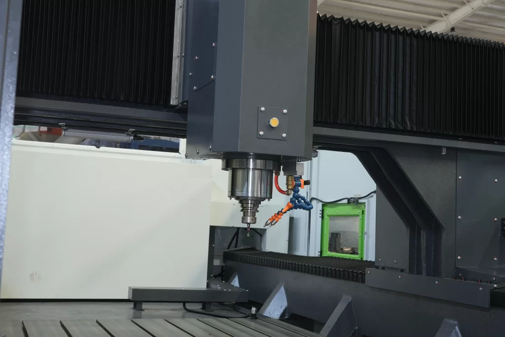 Detailed shot of the spindle, worktable, and internal machining area of CNC Gantry Machining Center MD, emphasizing precision components.