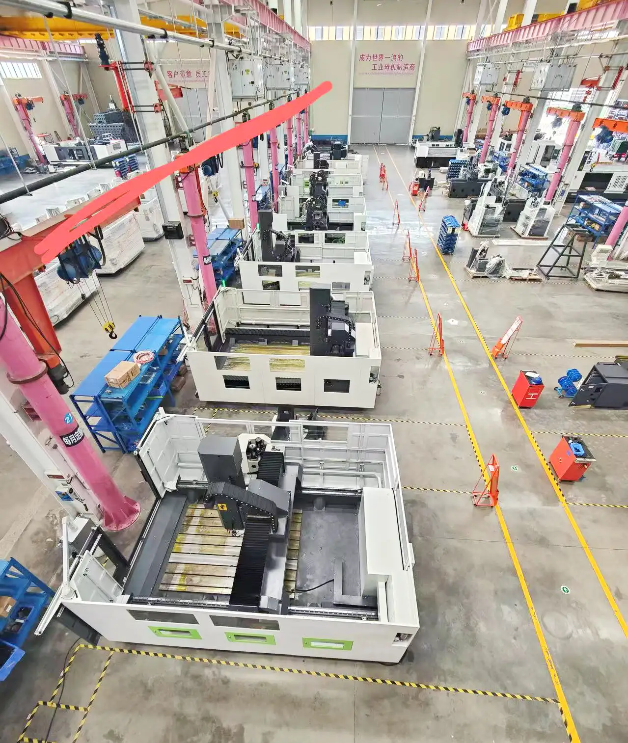 Aerial view of large-scale CNC machining plant with automated machines – showcasing high productivity, efficiency, and scalable production for precision manufacturing.