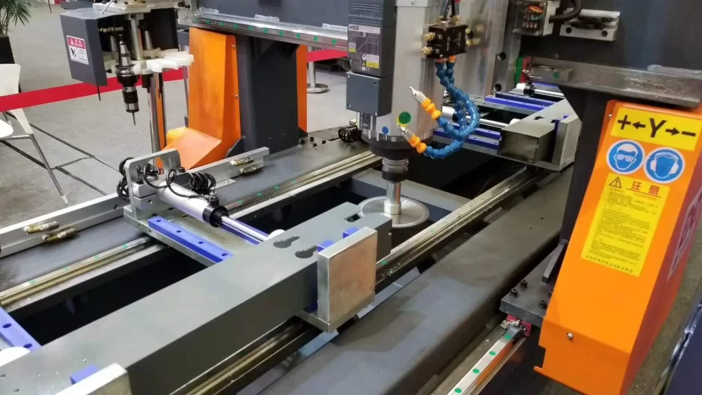 An aluminum profile CNC machine operates, with G-code directing cutting paths and M-code managing coolant/spindle, optimized for facade manufacturing.