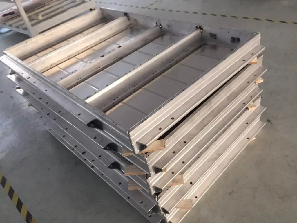 Stacked precision-machined parts for batch production quality control.