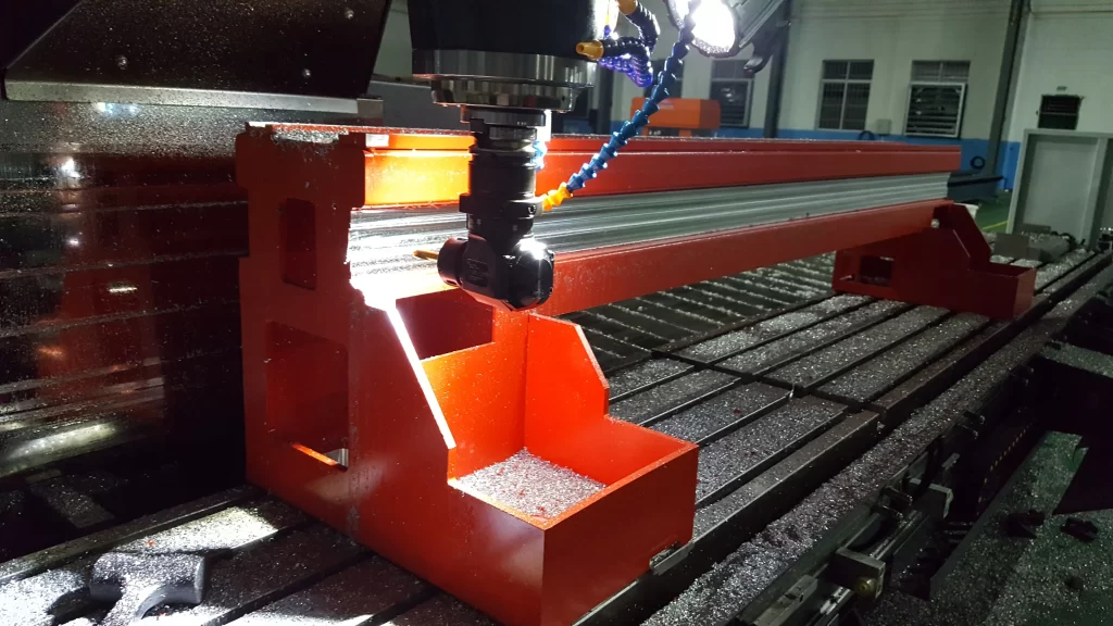 A CNC machine cutting a metal workpiece during high-precision processing.