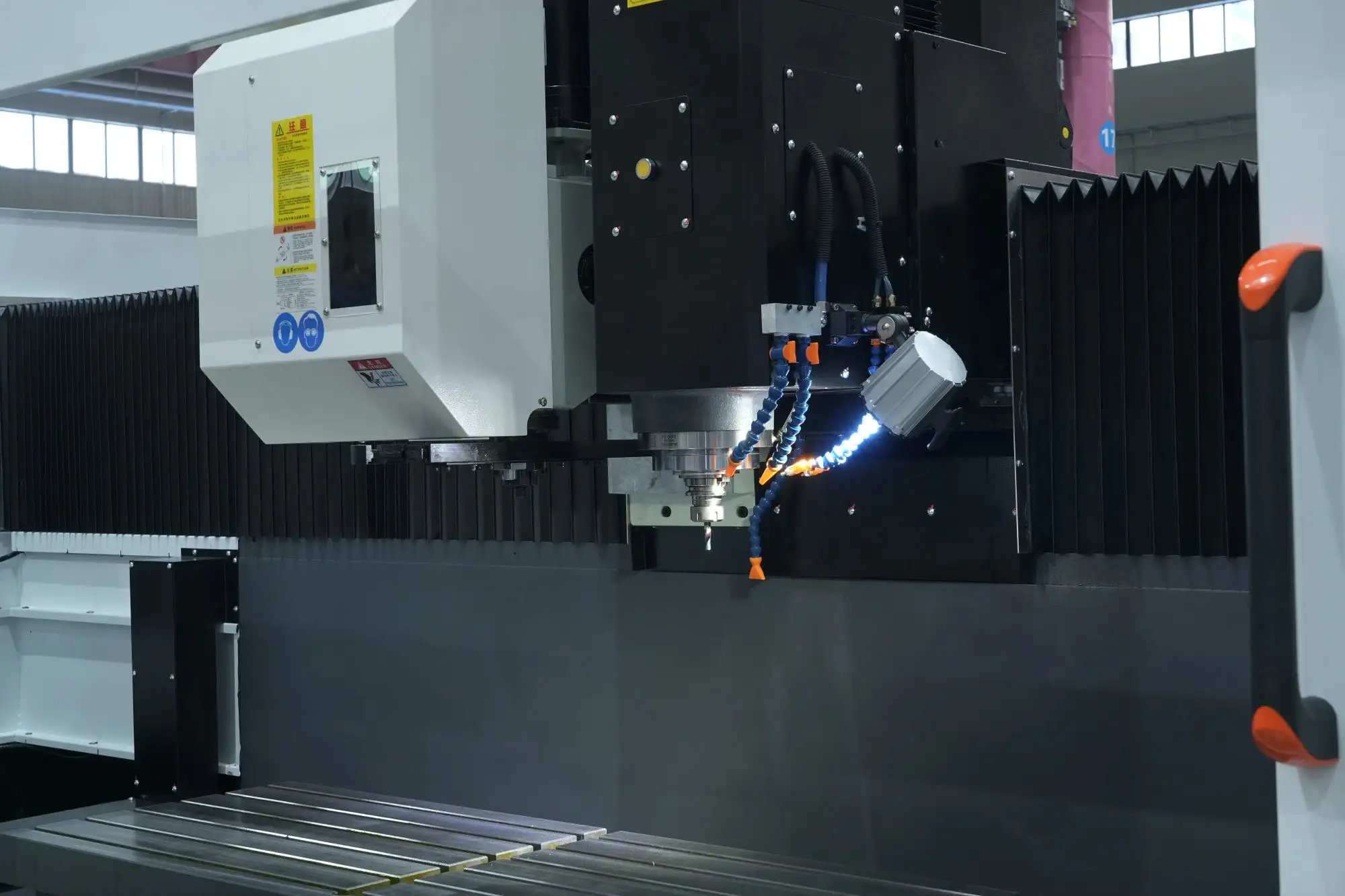 A CNC machine’s spindle cutting a workpiece, with coolant jets active. Highlights spindle speed/power performance, critical for material machining (e.g., aluminum/steel) and precision surface finishes.