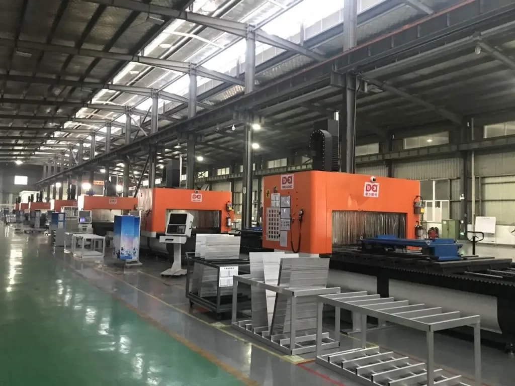 Rows of metal CNC machines operate in a spacious industrial workshop, showcasing large - scale precision metal processing capabilities for manufacturing.