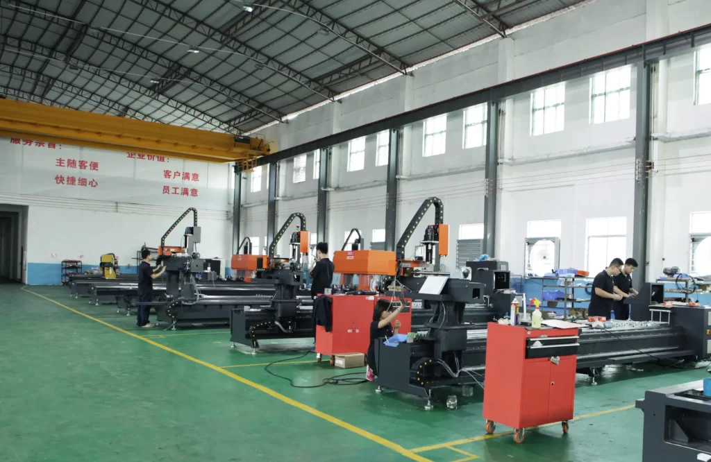 Multiple CNC machining equipment arranged in an orderly manner in a factory workshop, with workers operating the equipment and processing workpieces. It presents a large-scale production environment, reflecting the application of CNC machining equipment in actual production, involving parts processing for automotive manufacturing, rail transit, etc.