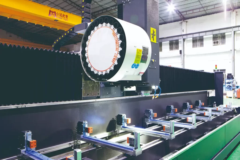 Closeup of SCA CNC milling machine's tool turret and worktable with clamping fixtures, highlighting precision machining components.